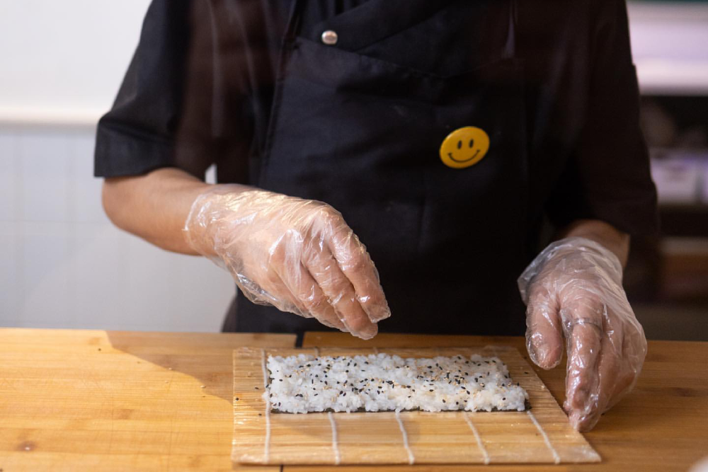 Japanese chefs preparing authentic sushi at Daily Sushi ITPL